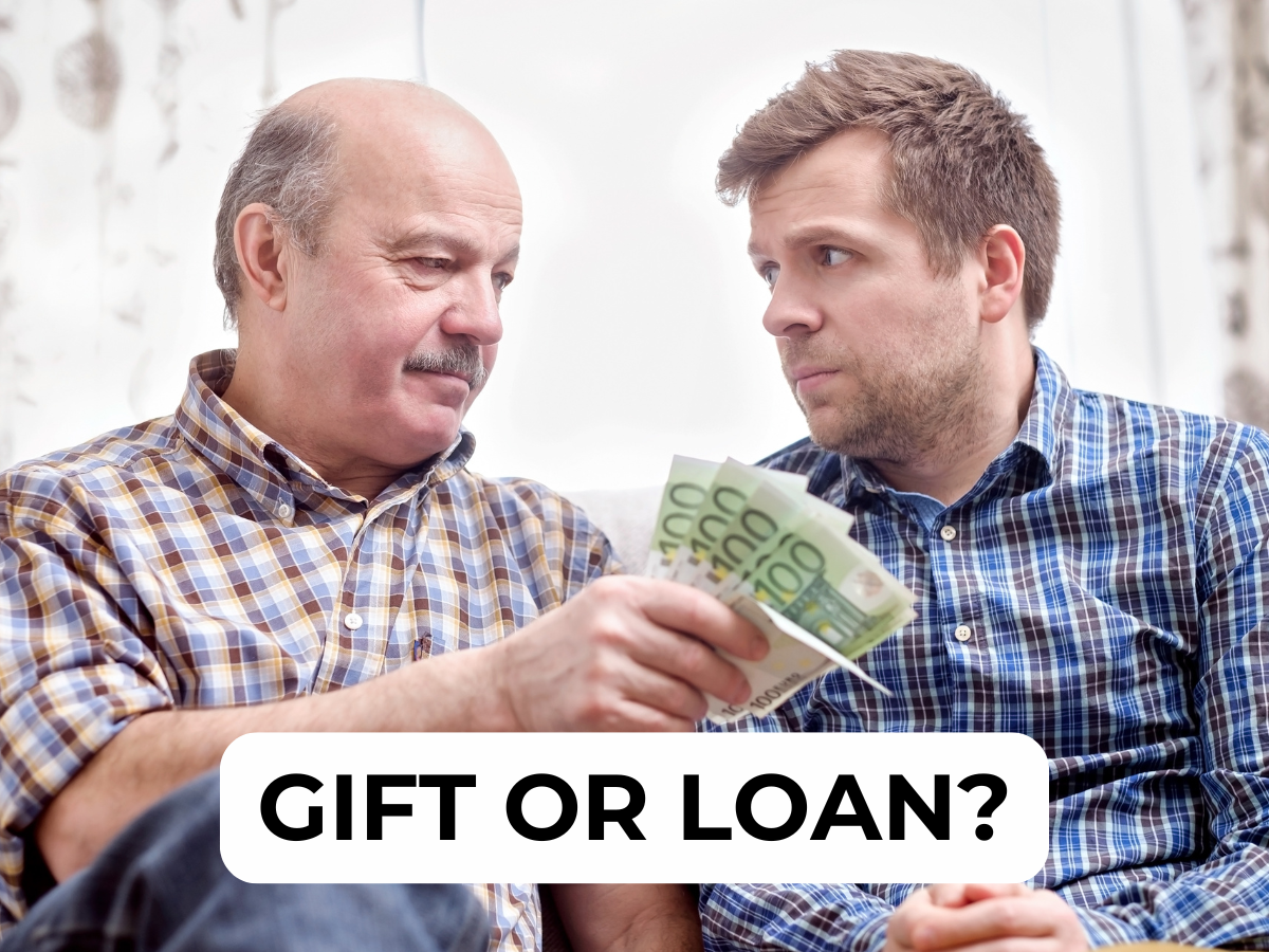 a man giving another man a bundle of money gift or loan